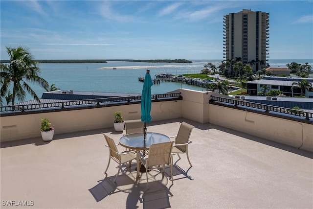 view of patio with a water view