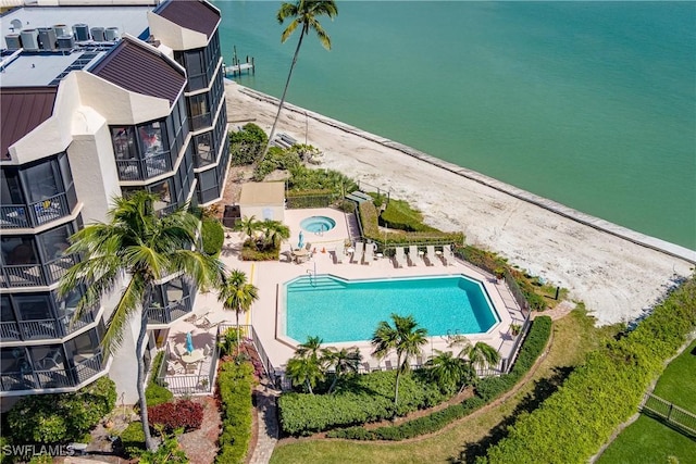 birds eye view of property with a water view