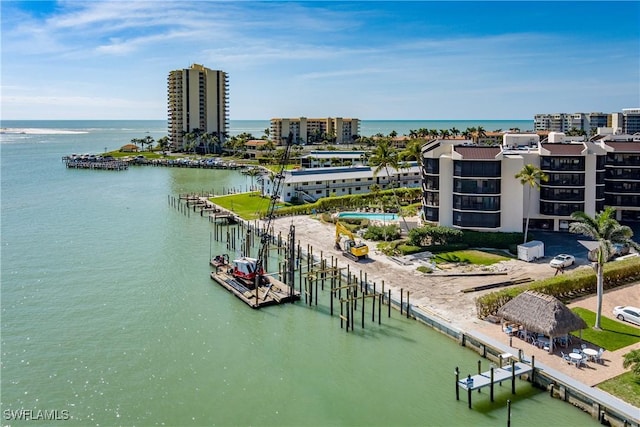 birds eye view of property with a water view