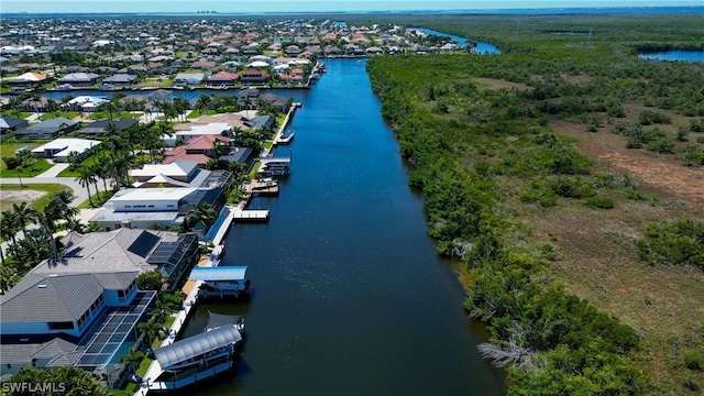 bird's eye view featuring a water view and a residential view