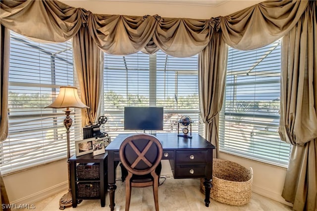 office area with plenty of natural light and baseboards