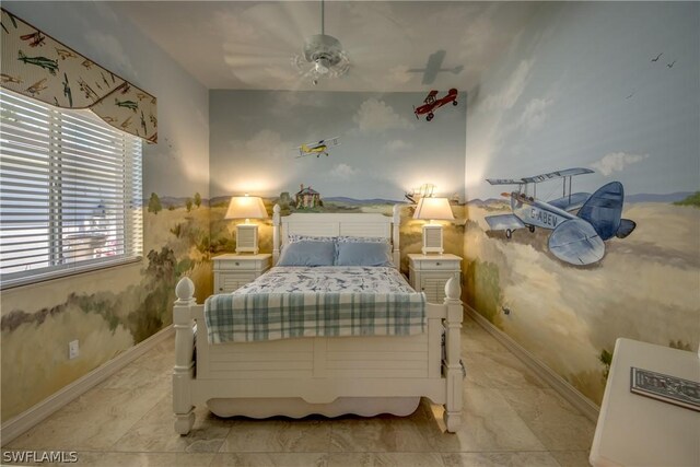 tiled bedroom featuring ceiling fan