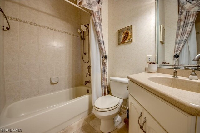 full bathroom with tile patterned flooring, vanity, toilet, and shower / bath combo