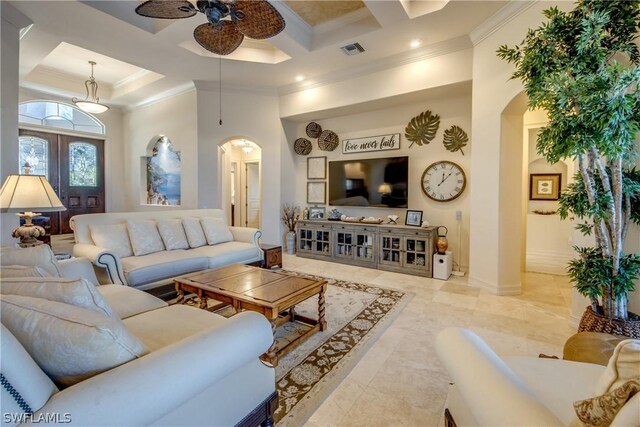 tiled living room with coffered ceiling, a high ceiling, crown molding, ceiling fan, and french doors