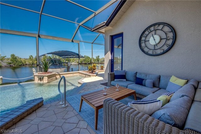 view of patio / terrace with an outdoor living space, a lanai, and a water view