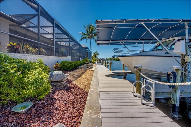 dock area featuring a water view and a lanai