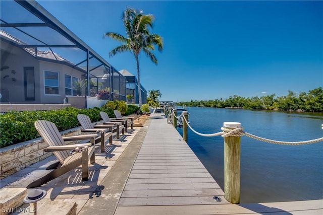 view of dock featuring a lanai and a water view