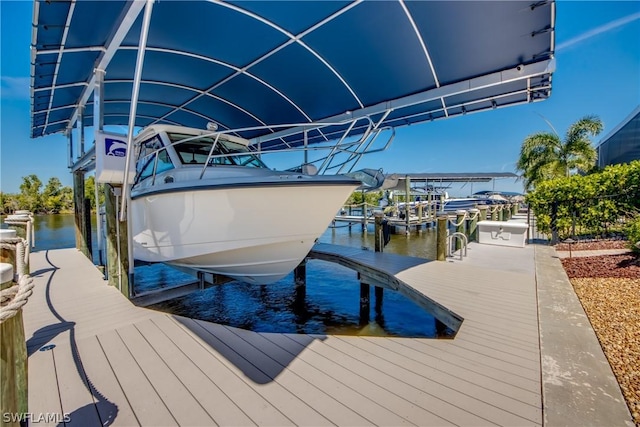 view of dock featuring a water view and boat lift