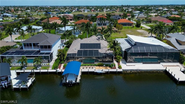 bird's eye view featuring a water view and a residential view