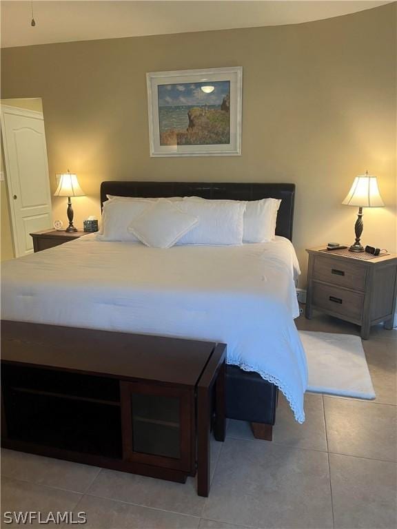 bedroom featuring light tile patterned flooring