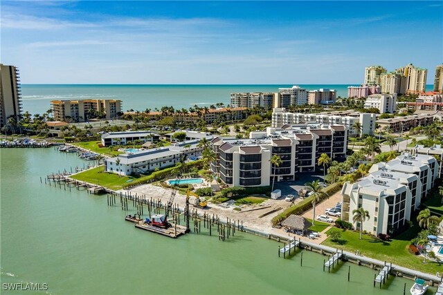 drone / aerial view featuring a water view and a city view