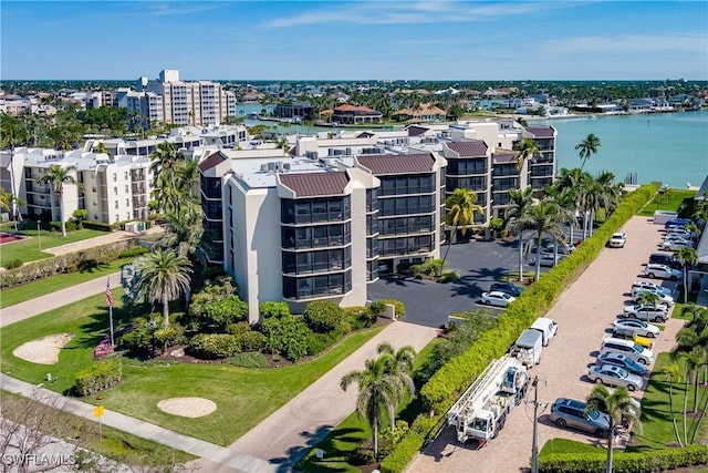 birds eye view of property with a water view