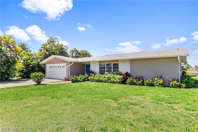 ranch-style house featuring a garage and a front lawn