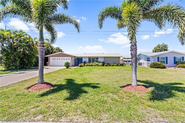 view of front of home featuring a garage and a front yard