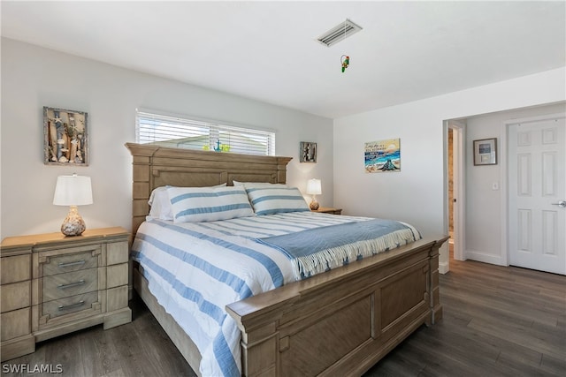 bedroom featuring dark wood-type flooring