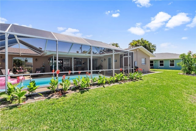 back of property featuring a lawn and a lanai