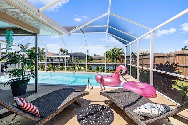 view of pool featuring a lanai, a patio, and a water view