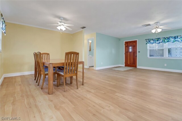 dining room with ceiling fan and light wood-type flooring