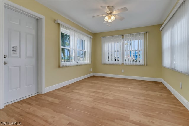 unfurnished room with ceiling fan and light hardwood / wood-style flooring