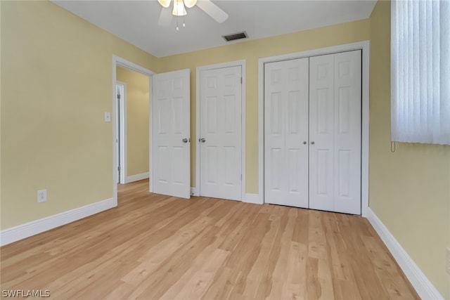 unfurnished bedroom featuring ceiling fan and light hardwood / wood-style floors