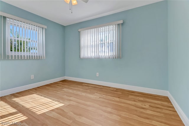 unfurnished room with ceiling fan and light hardwood / wood-style flooring