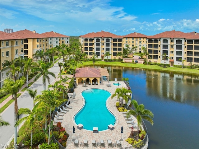 view of swimming pool with a water view