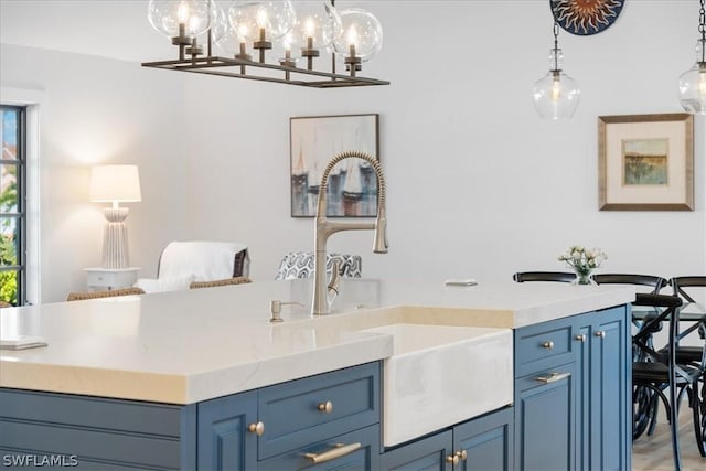 bathroom with sink and an inviting chandelier