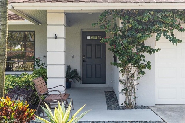 doorway to property with a porch