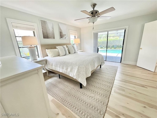 bedroom featuring access to outside, light hardwood / wood-style flooring, and ceiling fan