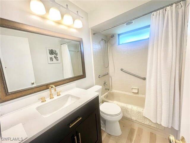 full bathroom featuring shower / bath combo, toilet, and vanity