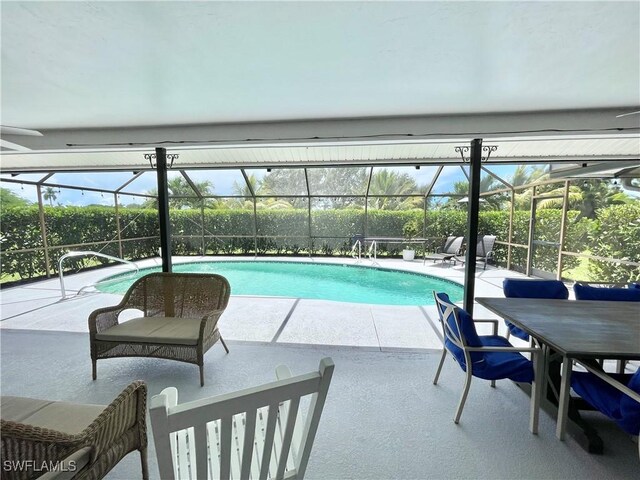 view of swimming pool featuring a patio area