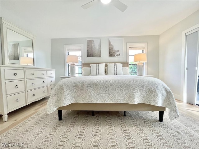 bedroom featuring light hardwood / wood-style flooring and ceiling fan