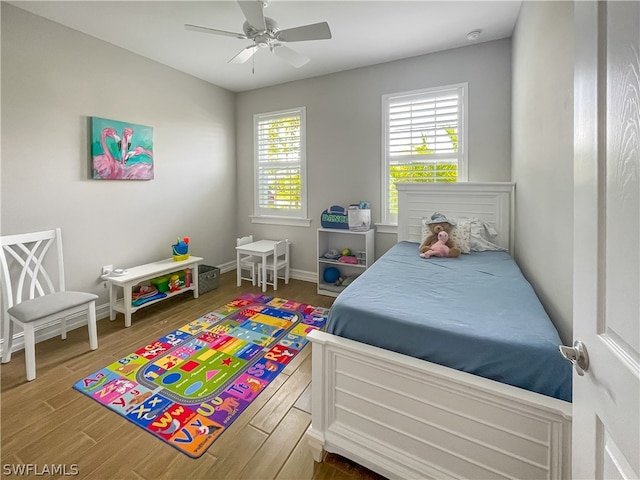 bedroom featuring ceiling fan and hardwood / wood-style floors