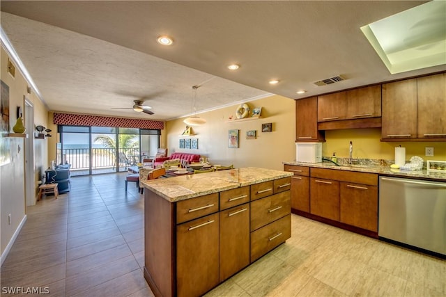 kitchen featuring sink, stainless steel dishwasher, ceiling fan, a kitchen island, and light stone counters