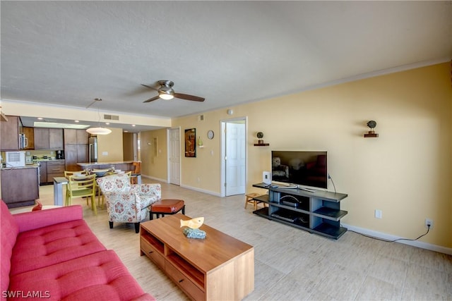 living room with ceiling fan