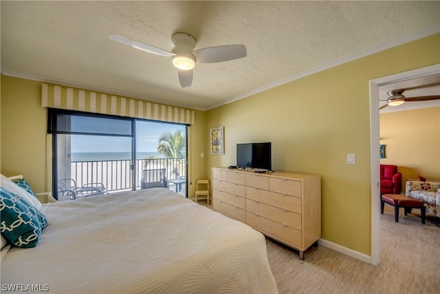 bedroom featuring access to exterior, ceiling fan, crown molding, and a textured ceiling