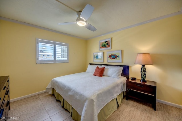 bedroom featuring ceiling fan and ornamental molding