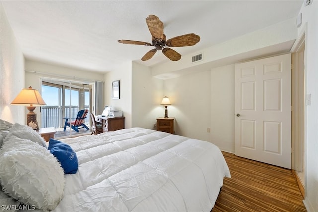 bedroom featuring hardwood / wood-style flooring and ceiling fan