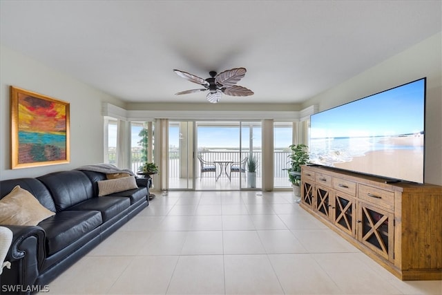 tiled living room with ceiling fan