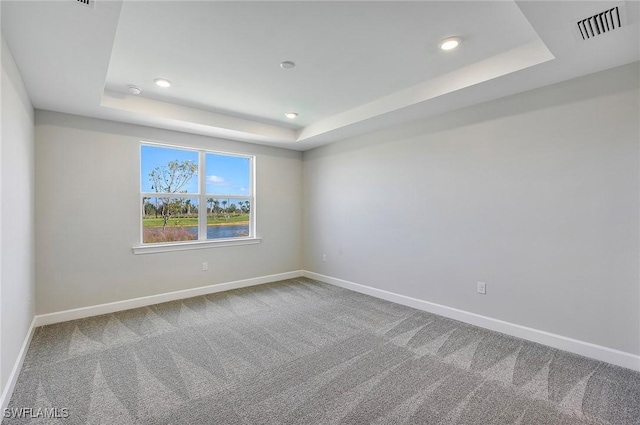 12445 Basalt Ln, Alva, FL 33982 - carpeted empty room featuring a raised ceiling, baseboards, and recessed lighting