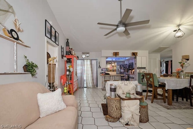 tiled living room with ceiling fan