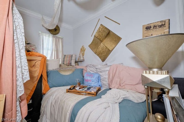 bedroom with ornamental molding