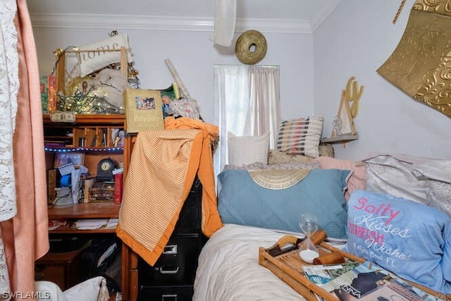 bedroom with ornamental molding