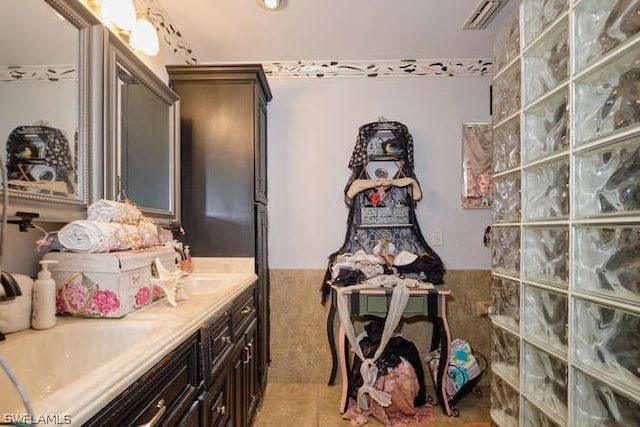 bathroom with vanity and tile floors