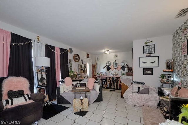 living room featuring light tile flooring