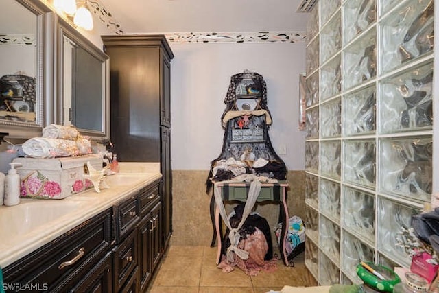 bathroom with tile flooring and vanity