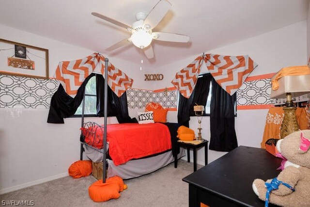 bedroom featuring light carpet and ceiling fan