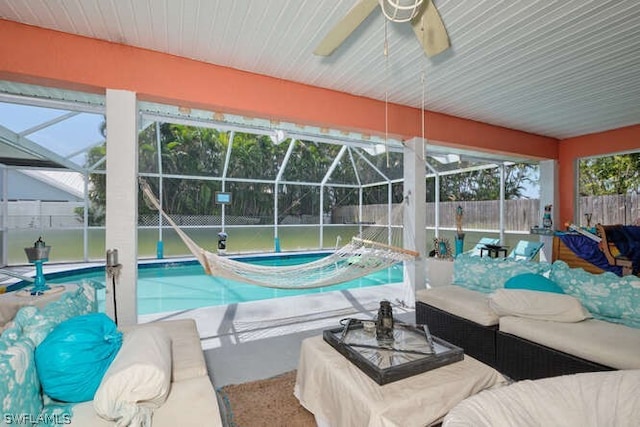 view of pool featuring a patio, glass enclosure, an outdoor living space, and an in ground hot tub