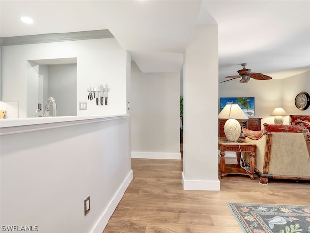 corridor with light hardwood / wood-style floors