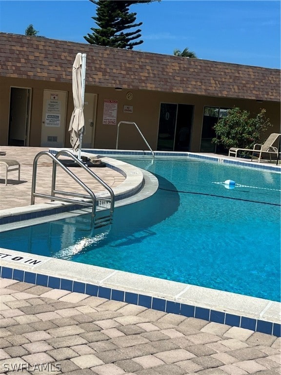 view of swimming pool with a patio